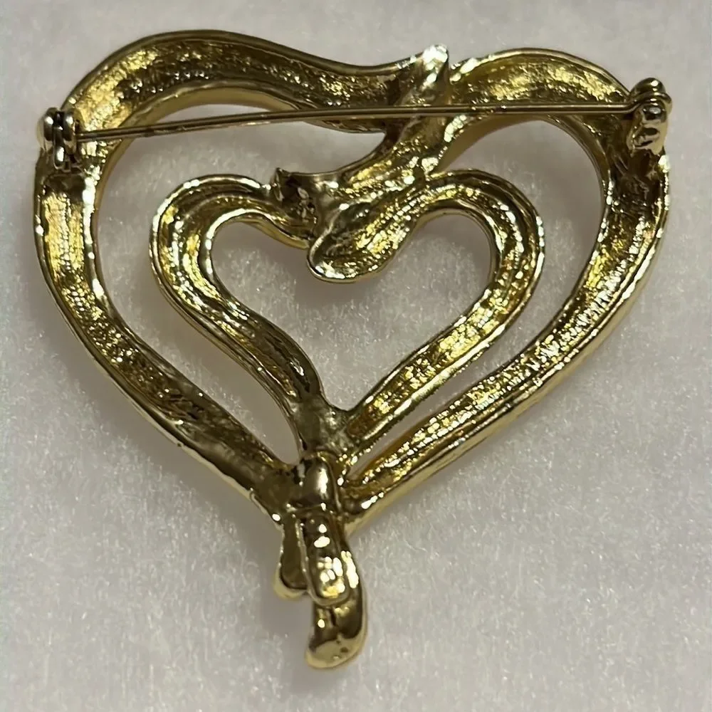Elegant Golden AJC Brooch with Dual Hearts